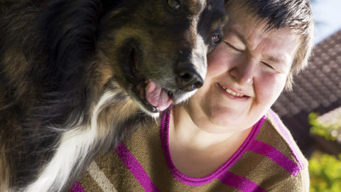 A person with their animal assisted therapy dog