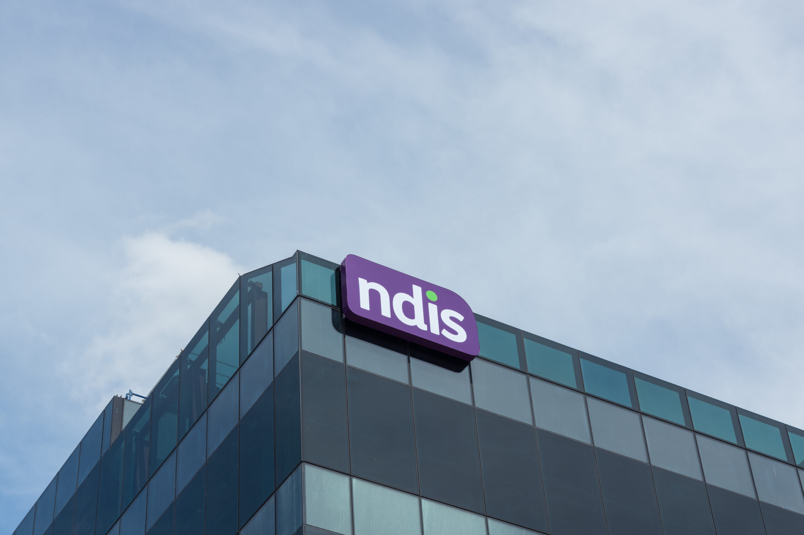 The NDIS logo on a large building