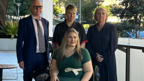 Simon Burchill, Matilda Alexander, Michelle Moss and Marayke Jonkers look resolute as they react to the Australian Government's Disability Royal Commission Response