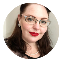 Megan Spindler-Smith - People with Disability Australia Megan Spindler Smith wering clear glasses and bright red lipstick