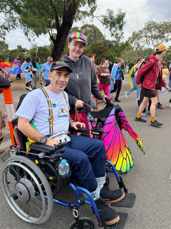 PWDA President Jeramy Hope and his daughter. They are wearing colourful clothes and looking at the camera.