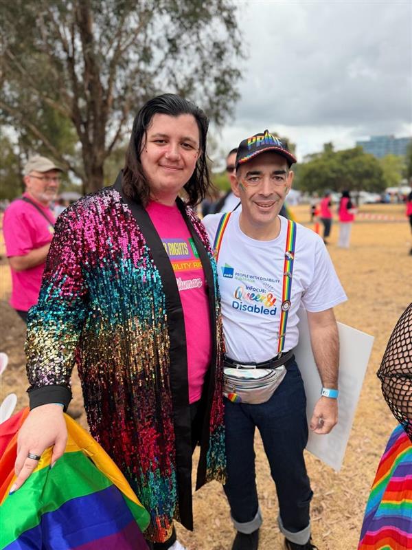 PWDA President Jeramy Hope with PWDA member. Both people are smiling at the camera.