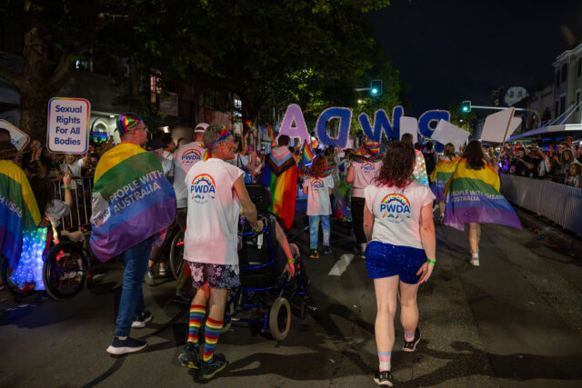 PWDA participants walking up Oxford Street at Mardi Gras 2026
