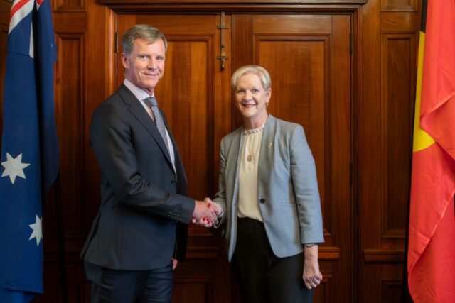 Dan Stubbs shaking hands with the Hon Maree Edwards MP, Speaker of the Legislative Assembly of Victoria. 